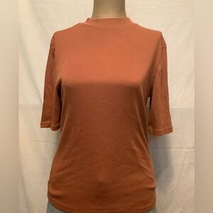 A. New Day Women's Medium Rust Colored Minimalistic Mid-length Sleeved Top
